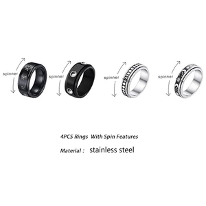Set of 4 stainless steel spinner rings featuring moon phase and celestial patterns