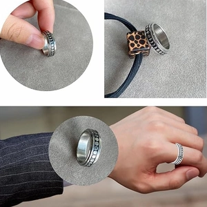 Detailed views of silver stainless steel moon phase spinner ring for anxiety relief