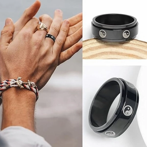 Black stainless steel spinner ring set for men with Yin Yang pattern and polished finish