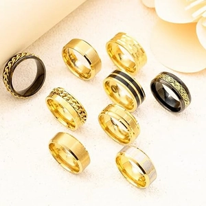 Set of 9 stainless steel spinner rings for anxiety relief in gold and black finishes