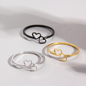 Minimalist double heart ring set in black, gold, and silver finishes for women