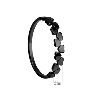 Macro detail of minimalist black heart clover ring band showing 3mm width measurement