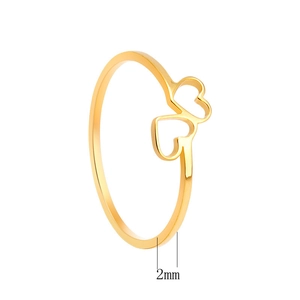 Detail showing two interlocking hollow heart shapes on a 2mm gold minimalist ring