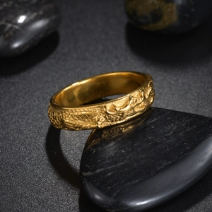 Vintage punk dragon ring in golden finish featuring detailed 3D relief on a dark stone