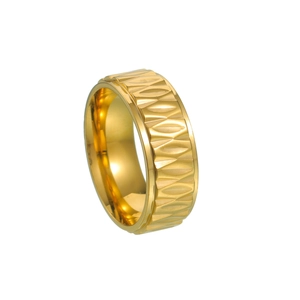 Macro shot of gold polished metal ring featuring intricate geometric leaf relief patterns