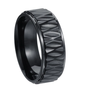 Men's vintage black stainless steel ring with geometric carved pattern on white background