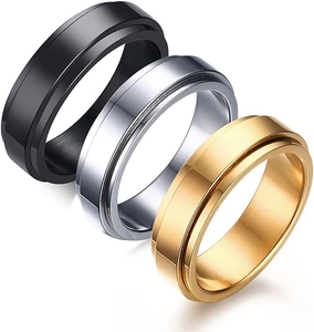 Three-piece set of 6mm spinner rings in black, silver, and gold polished stainless steel