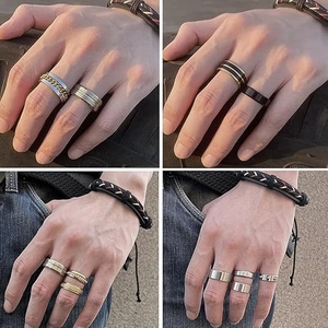Men's 16-piece set of stainless steel rings and woven bracelet shown on model