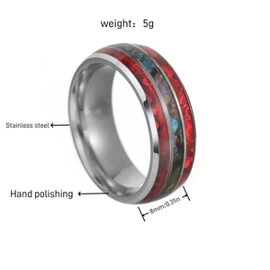 Detailed view of 8mm stainless steel ring with red glitter and abalone shell inlay