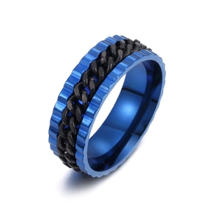 Detail of blue electroplated gear edges and rotating black cuban chain on steel ring