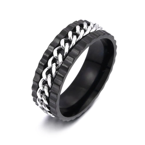 Macro shot of rotatable gear ring with black brushed finish and silver chain inlay