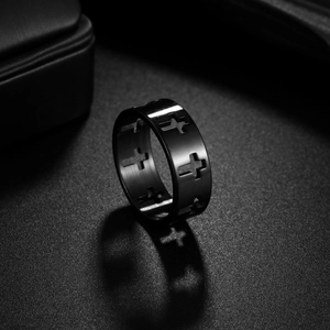 Cross hollow out ring in black matte stainless steel for men and women on dark background