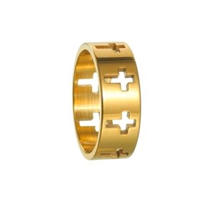 Macro detail of gold hollow cross ring with polished religious gothic design pattern