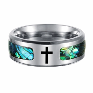 Close-up of titanium ring with iridescent abalone shell inlay and black cross motif