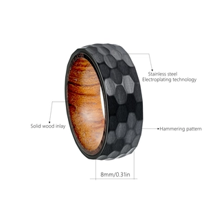 Macro shot of 8mm titanium steel ring with hammered texture and pear wood inlay details