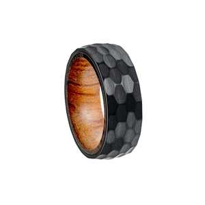 Detail of 8mm black hammered titanium ring with dark pearwood inner inlay for men