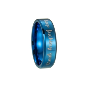 Macro shot of blue brushed stainless steel band with engraved keep fucking going text