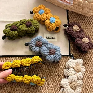 Handmade crochet floral banana hair clips in various autumn colors for high ponytail styling