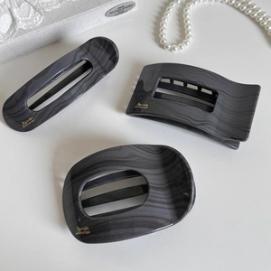 Three-piece set of elegant dark grey marble texture hair clips with golden inscriptions