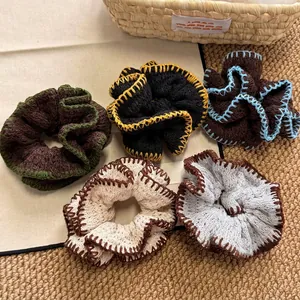 Set of five handmade crochet scrunchies in French vintage knit styles and warm colors
