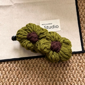 Handmade crochet flower banana hair clip in green wool for high ponytail styling