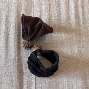 Retro leopard print beads elastic hair scrunchie for women on beige linen background