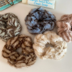 Plush leopard print scrunchies in various autumn colors for vintage hair styling
