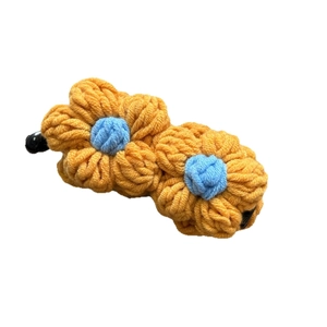 Handcrafted knitted flower banana hair clip with yellow and blue wool petals for women