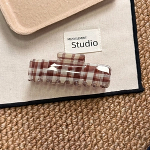 Brown and white checkered acetate hair claw clip for thick hair in rectangular design