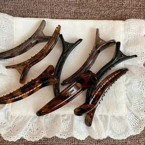 Set of six minimalist tortoiseshell and black acrylic duckbill hair clips for women