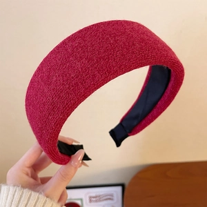 Detail showing red knitted wide headband texture with thick sponge padding for women