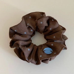 Vintage brown scrunchie with blue polka dots and a stylish logo charm for women