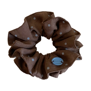 Vintage brown polka dot scrunchie with blue oval charm accessory for women hair styling