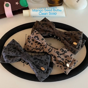 French vintage leopard print bow banana hair clips set in three colors with gold accents