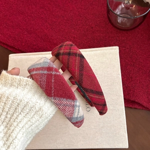 Thick red plaid headband made of wool fabric for women in a classic British style
