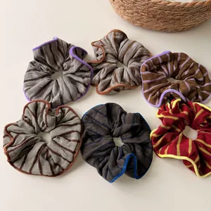 Set of six colorful retro striped knitted hair scrunchies with soft ribbed cotton texture
