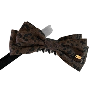 French vintage leopard print bow banana hair clip with a gold metallic pendant charm