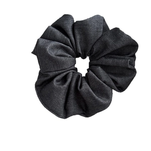 Minimalist dark grey denim fabric scrunchie with pleated design for effortless hairstyles