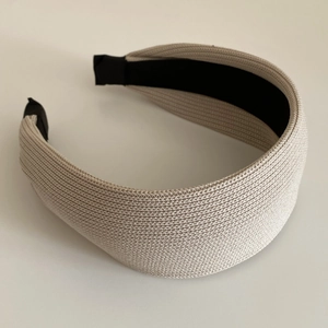 Minimalist beige braided headband with wide brim and black lining for women stylish hair accessory