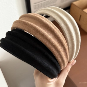 Three-pack padded suede headbands in black, brown and cream colors for volume