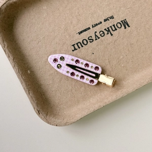 Vintage checkered hair clip with pink and green rhinestones and a gold metal base