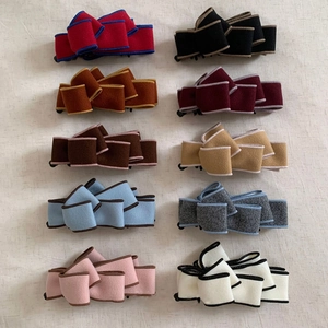 Set of 10 woolen bow banana hair clips with contrasting trim in various colors