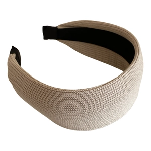 Elegant beige wide knitted headband with textured woven fabric and non-slip lining