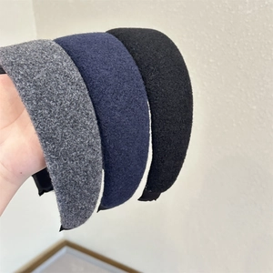 Three-piece set of wide wool felt headbands in grey, navy, and black colors