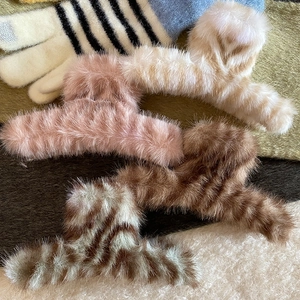 Faux fur hair claw clips in various colors and tiger patterns for autumn and winter styles