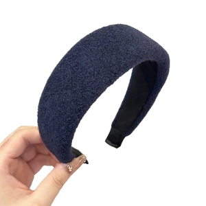 Navy blue wool textured sponge headband with high crown design for a vintage winter style