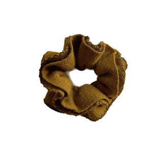 Deep brown knitted scrunchie with ribbed texture for elegant bun and ponytail styling
