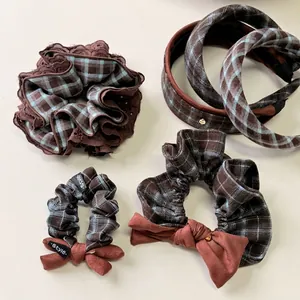 Retro blue and brown plaid scrunchie set with lace edges and bow detail for hair