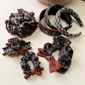 Blue and coffee checkered hair accessory set with scrunchies, headbands, and a claw clip