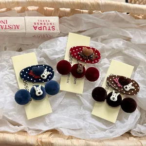 Polka dot bow hair clips with colorful plush pompoms and cute cartoon animal charms